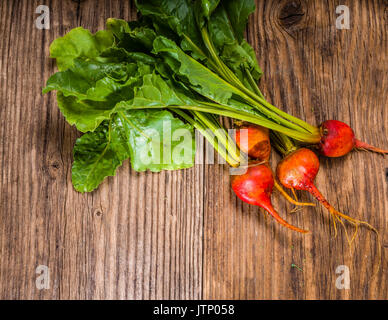 Orange beets on wooden table fresh from the garden Stock Photo