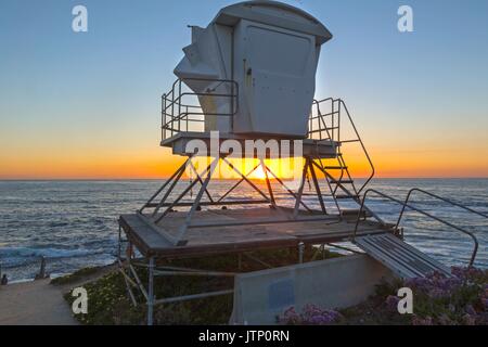 Beach Lifeguard Lookout Tower as Sun Sets behind Pacific Ocean Horizon in La Jolla north of San Diego California USA Stock Photo