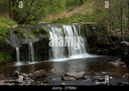 The upper of the two small waterfalls on the Afon Caerfanell near its confluence with the Nant Bwrefwr. Stock Photo