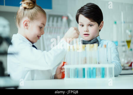 schoolchildren with science lab equipment in chemical lab, science school concept Stock Photo