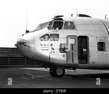 Left side view of a parked UC-123K Provider aircraft from the 315th Tactical Airlift Wing.  The aircraft, being inactivated, is named 'Patches' for the more than 1,000 hit-hole patches that it received during the Vietnam conflict.  The images painted on the aircraft are Snuffy Smith wearing a bullet-riddled hat and four Purple hearts, one for each aircrew member wounded in flight. Stock Photo