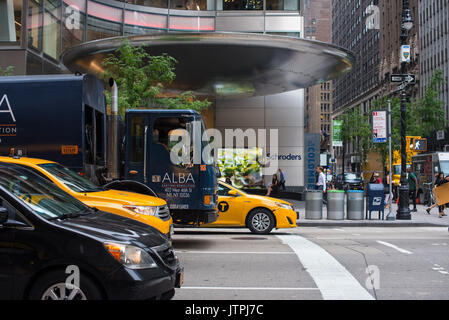 Two yellow cabs, a truck and a car lined up waiting for the traffic light to change.  Editorial Use Only Stock Photo