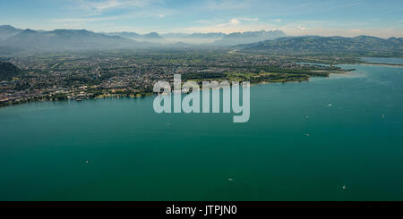 Panorama of lake constance with the city of Bregenz and Dornbirn and the alps in summer Stock Photo