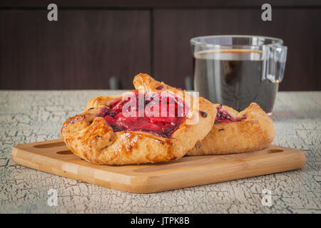 Homemade rustic fruit tarts served with fresh coffee. Stock Photo