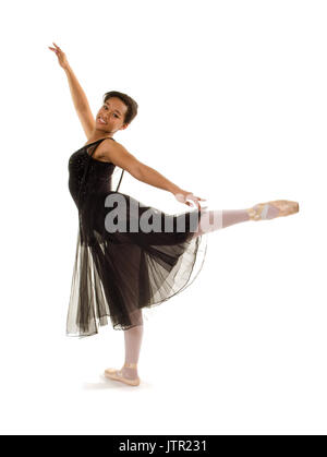 Smiling African American Ballerina in Arabesque Position Stock Photo