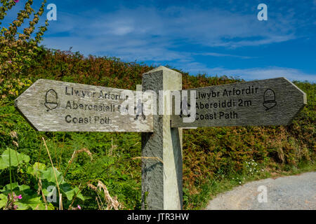 Signpost on the Wales/Pembrokeshire Coast Path near Porthgain, Pembrokeshire, Wales Stock Photo