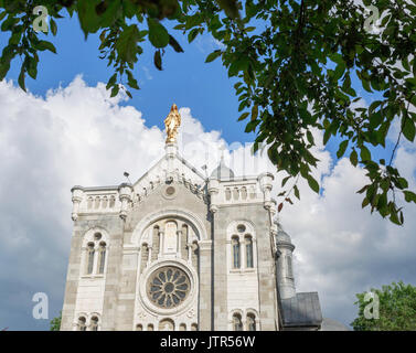 Upper facade and statue on a church in a small parish, Montreal Canada Stock Photo