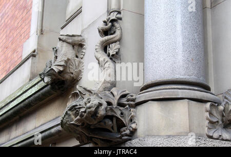 Carved stone grotesque on Minshull Street Crown Court building in Manchester Stock Photo