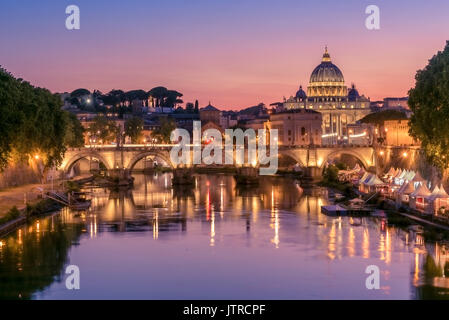 View of a stunning sunset setting behind the Vatican City from Ponte Umberto I, Rome, Italy Stock Photo
