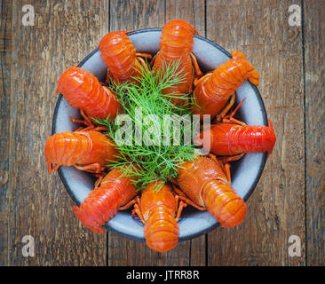 crawfish on wooden background in a plate Stock Photo