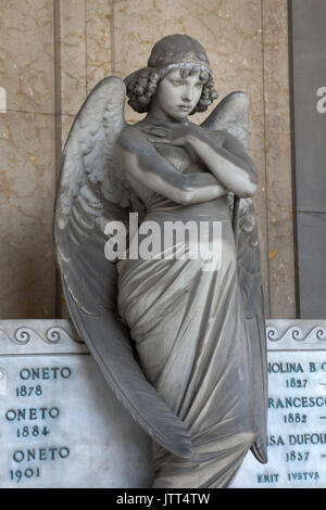 Mourning angel known as the Monteverde Angel (Angelo di Monteverde). Marble statue by Italian sculptor Giulio Monteverde (1882) on the funeral monument to the Oneto Family at the Staglieno Monumental Cemetery (Cimitero monumentale di Staglieno) in Genoa, Liguria, Italy. Stock Photo
