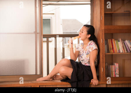 Lifestyle of a Japanese girl at home during the hottest days of summer. Stock Photo