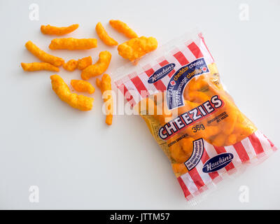 A bag of Cheezies, a brand of cheese puffs snack food made and sold in Canada by W.T. Hawkins Ltd. Stock Photo