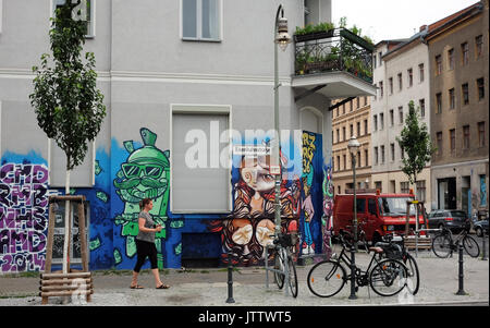 Graffiti on a building's exterior wall pictured in the corner of Eisenbahnstrasse and Wrangelstrasse in the Kreuzberg district of Berlin, Germany, 03 Augustr 2017. Photo: Jens Kalaene/dpa-Zentralbild/ZB Stock Photo