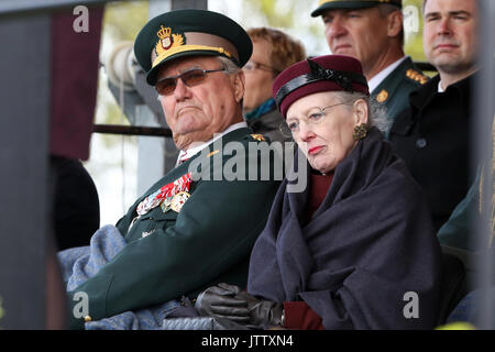 Sonderborg, Denmark. 18th Apr, 2014. Danish Queen Margrethe II and her husband Prince Henrik (L) take part in the ceremony to mark the 150th anniversary of the Battle of Dybbol in Sonderborg, Denmark, 18 April 2014. 150 years ago, the Germans and Danes fought over Schleswig-Holstein. The war climaxed with the Battle of Dybbol. The anniversary on 18 April will be widely celebrated in Denmark. Photo: BODO MARKS/dpa | usage worldwide/dpa/Alamy Live News Stock Photo