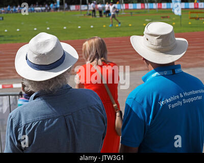 Sheffield, UK. 10th August, 2017. Spectators in sunhats watching athletics at Special Olympics National Games in Sheffield in sunshine Credit: Steve Holroyd/Alamy Live News Stock Photo