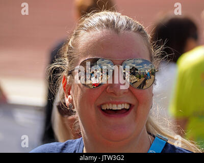 Sheffield, UK. 10th August, 2017. Spectators refelected in sunglasses of one supporter at Special Olympics National Games in Sheffield Credit: Steve Holroyd/Alamy Live News Stock Photo