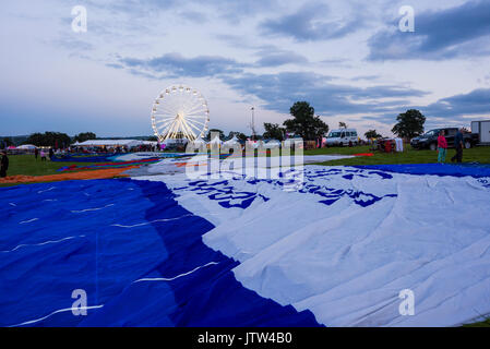 Balloons being prepared for the night glow taking place at the Bristol Balloon Fiesta at Ashton Court, Bristol, England. Stock Photo