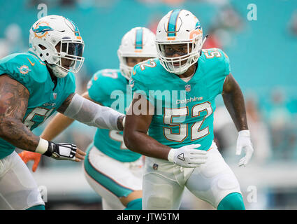 Miami Dolphins linebacker Raekwon McMillan (52) walks the sidelines, during  the second half of an NFL preseason football game against the Tampa Bay  Buccaneers, Thursday, Aug. 9, 2018, in Miami Gardens, Fla. (