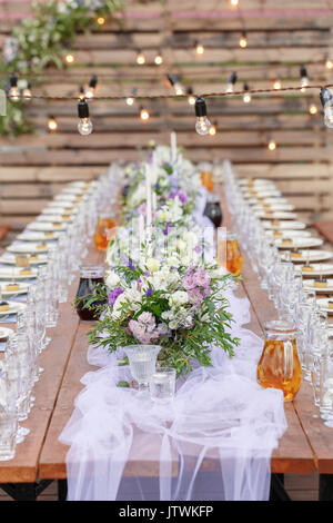 Glasses on the festive table setting. Wedding table decor concept. Table setting in classic style, setout. fine art. Stock Photo
