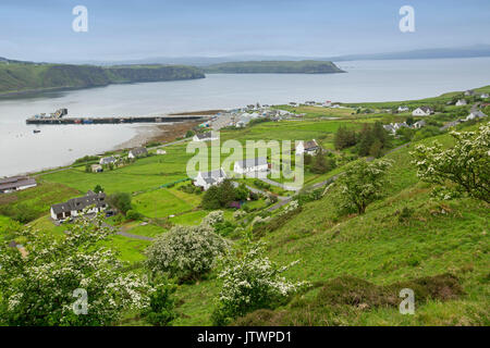 Vast view, from high lookout, of town and harbour surrounded by hills and mountains at Uig, Isle of Skye, Scotland Stock Photo