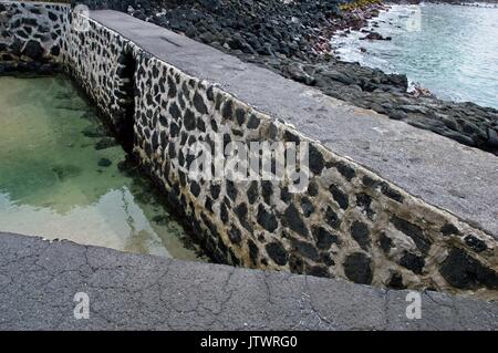 Hawaii fish pond gate hi-res stock photography and images - Alamy