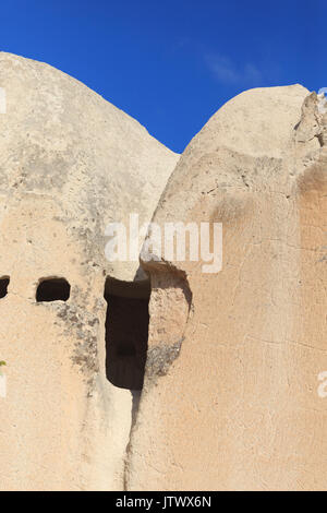 Vertical shot of fragment of cave church in Cappadocia shot with sharp light Stock Photo