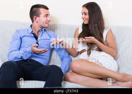 Relaxed european husband and wife joking about something at home Stock Photo