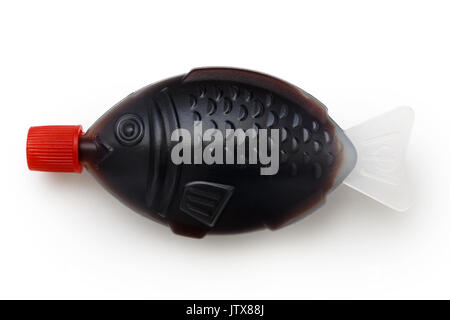 Fish shaped take away soya sauce isolated on white from above. Stock Photo