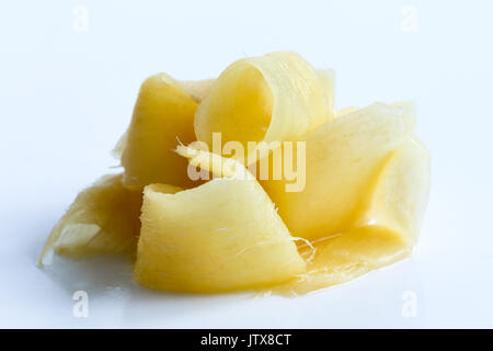 Heap of pickled ginger slices isolated on white. Stock Photo