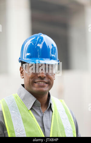 Portrait of a male Indian industrial engineer or builder at work. Stock Photo