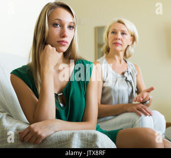 Upset woman and her mature mother having conflict Stock Photo