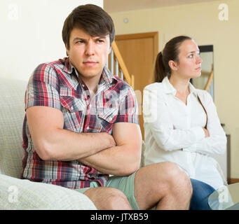 Woman having problems with her russian husband at home Stock Photo