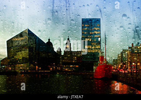 Looking through a misty window with raindrops at Liverpool waterfront buildings Stock Photo