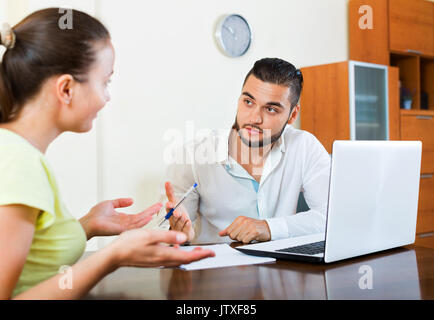 Upset pair having problems with contract at home Stock Photo