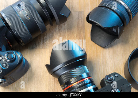 desktop with photography equipment, camera, lenses Stock Photo