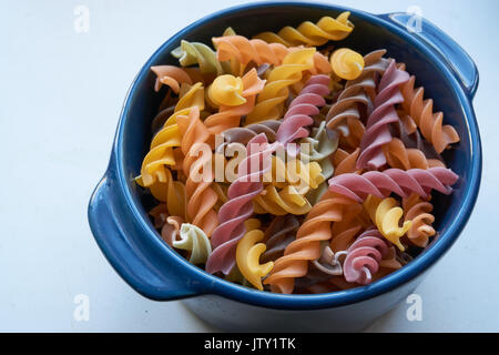 ceramic bowl with spiral italian pasta. made from whole grain wheat Stock Photo