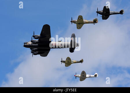 Royal Air Force Battle of Britain Memorial Flight Lancaster, Spitfires and Hurricane flying at an airshow Stock Photo