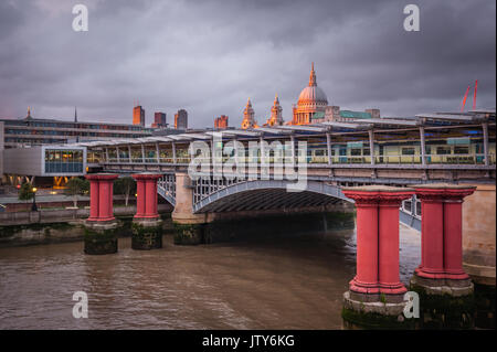 London, England - July 26, 2017 :  Blackfriars overground train and tube station with St Paul Cathedral dome in the background, London, England Stock Photo