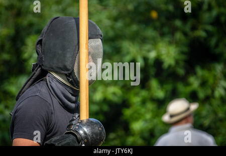 London, England -  June 2017 : Man dressed as a knight holding wooden spear weapon during medieval festival in Streatham in London Stock Photo