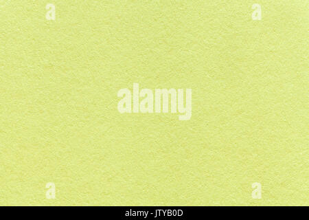 Texture of old light green paper background, closeup. Structure of dense olive cardboard. Stock Photo