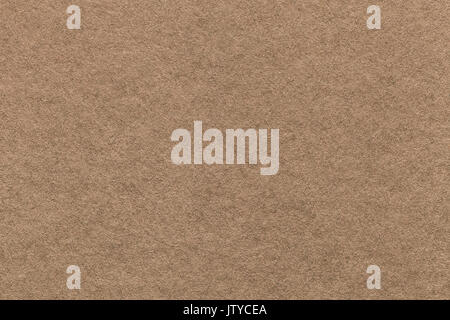 Texture of old light brown paper background, closeup. Structure of dense cardboard. Stock Photo