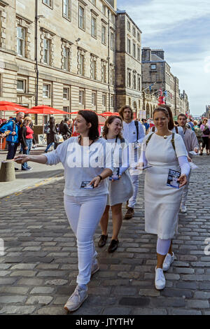 Swiss group L'auftritt promoting show Leere Zeit - Idle Time in Edinburgh Festival Fringe 2017 in the High Street of Royal Mile Edinburgh Scotland UK Stock Photo