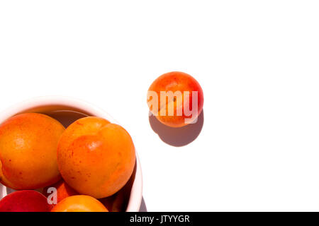 Apricot. Ripe apricots fruit isolated on a white. Stock Photo
