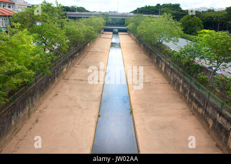 Rainwater stream running through the city Stock Photo