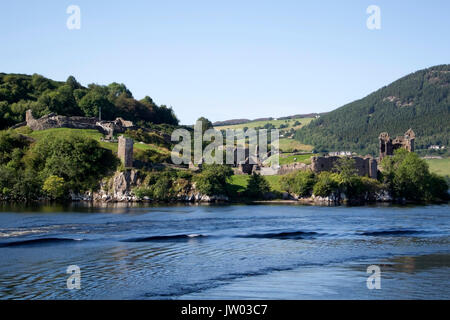 Historic Ruined Urquhart Castle Loch Ness Scotland landscape view of rocky promontory Strone Point and ruins of 13th to 16th century Urquhart Castle G Stock Photo