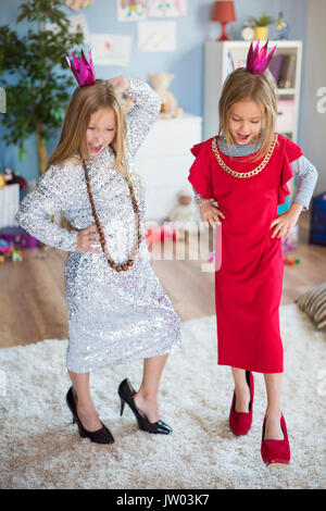 Future models having fun in the living room Stock Photo