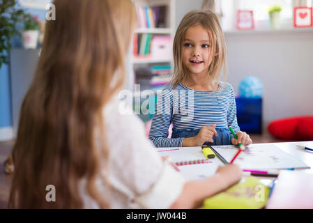 Small talk during the drawing some pictures Stock Photo