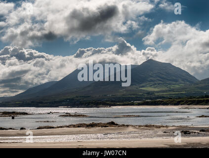 Croagh Patrick in clouds seen from Louisburgh small harbor in Ireland Stock Photo