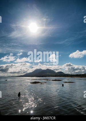 Croagh Patrick in clouds seen from Louisburgh small harbor in Ireland Stock Photo